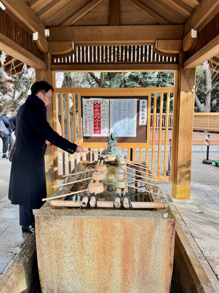 Cleansing before visiting a shrine at Atago Jinja in Tokyo