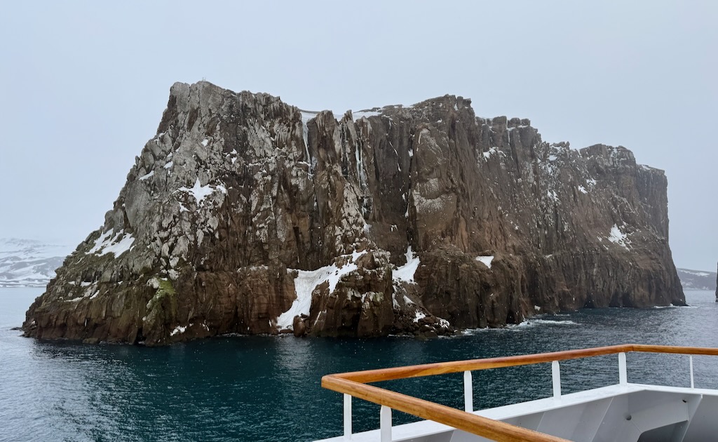 Deception island Antarctica with old whaling stations at the far left