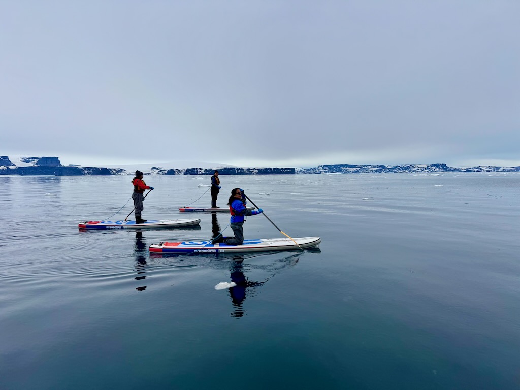 Standup paddle boarding at Vortex island, Antarctica 