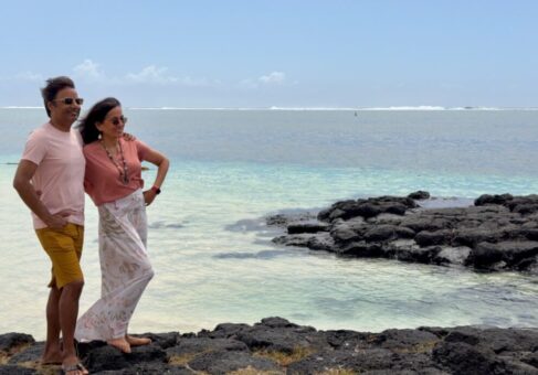 Nirmal and Jyoti on a beach in Mauritius