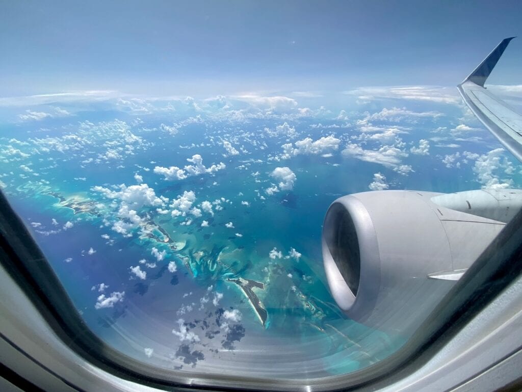 Aerial view of Caribbean islands and turquoise waters from a long-haul flight window seat