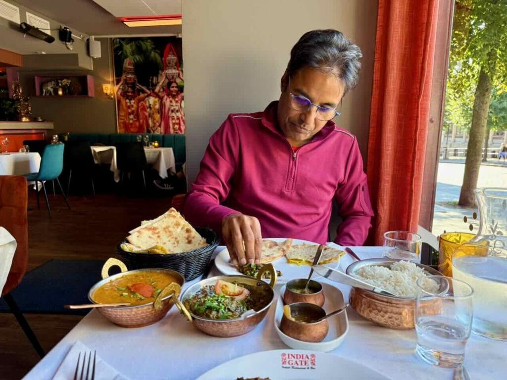 Indian restaurant meal of daal, aalu-palak, and roti in Bergen, Norway.