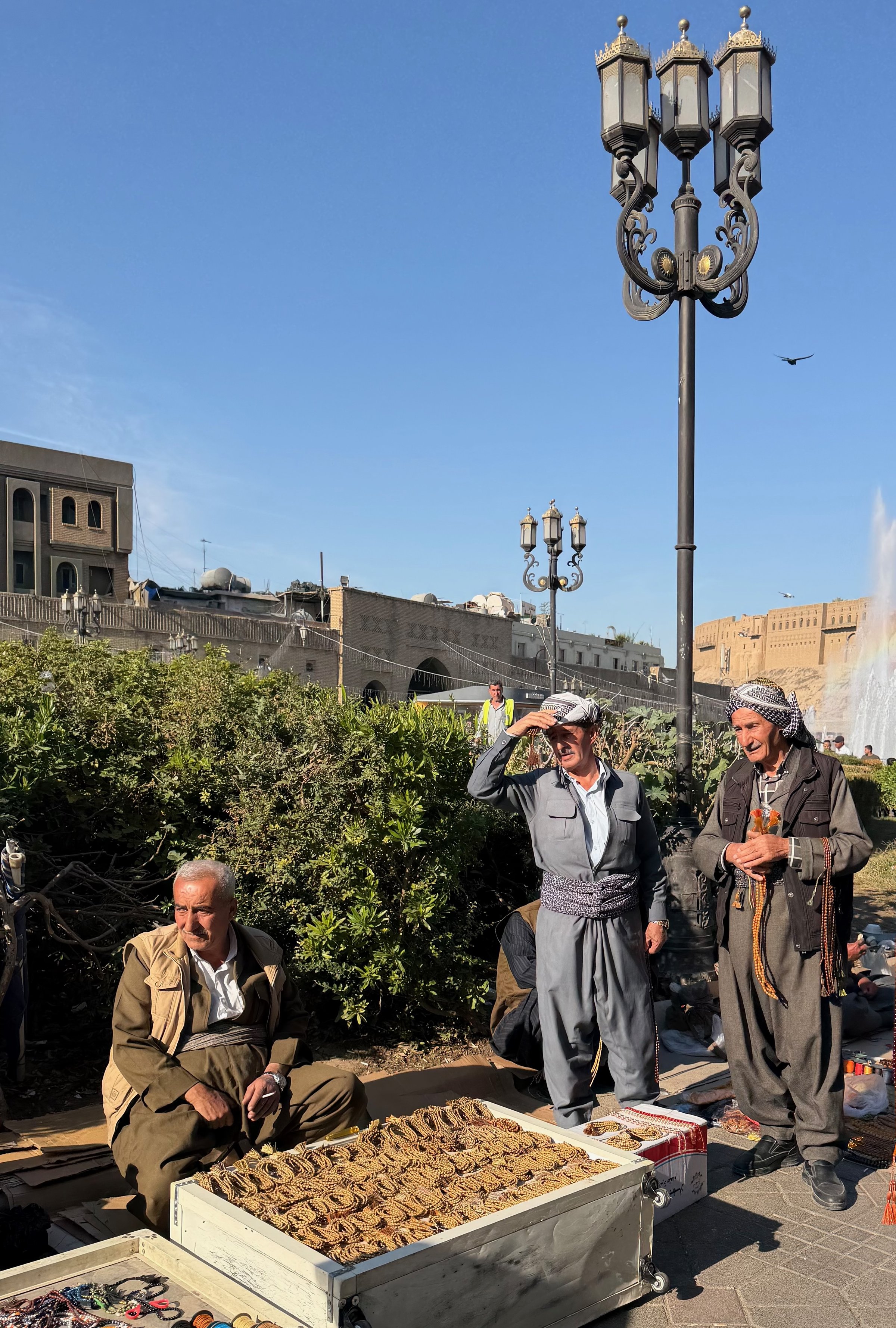 Kurdish men selling prayer beads and jewellery at a stall in the Erbil Citadel bazaar, Iraqi Kurdistan