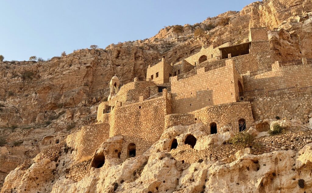 The lower cave cells carved into the cliff face at Rabban Hormizd Monastery near Alqosh, northern Iraq
