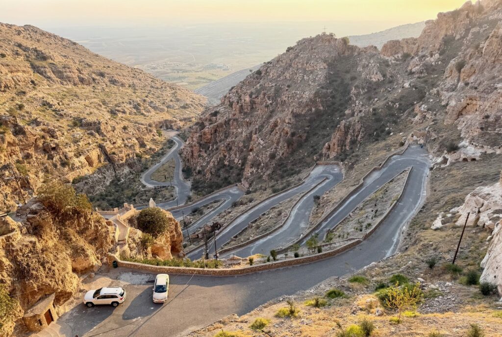 The switchback road leading up to Rabban Hormizd Monastery above Alqosh with the Nineveh Plains visible below, northern Iraq