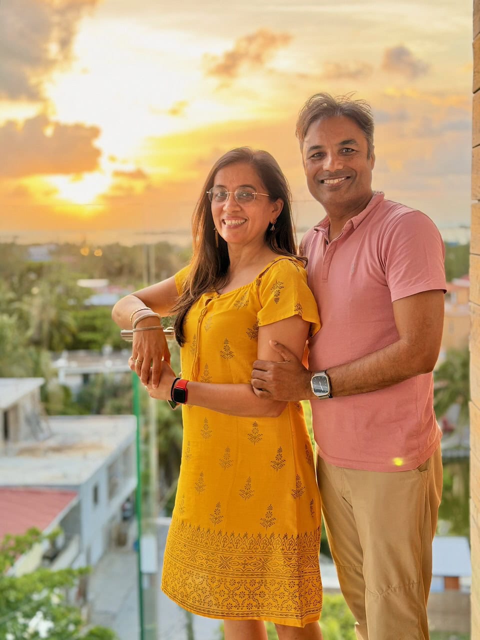 Nirmal Jyoti at Alaia rooftop bar with the San Pedro, Belize sunset