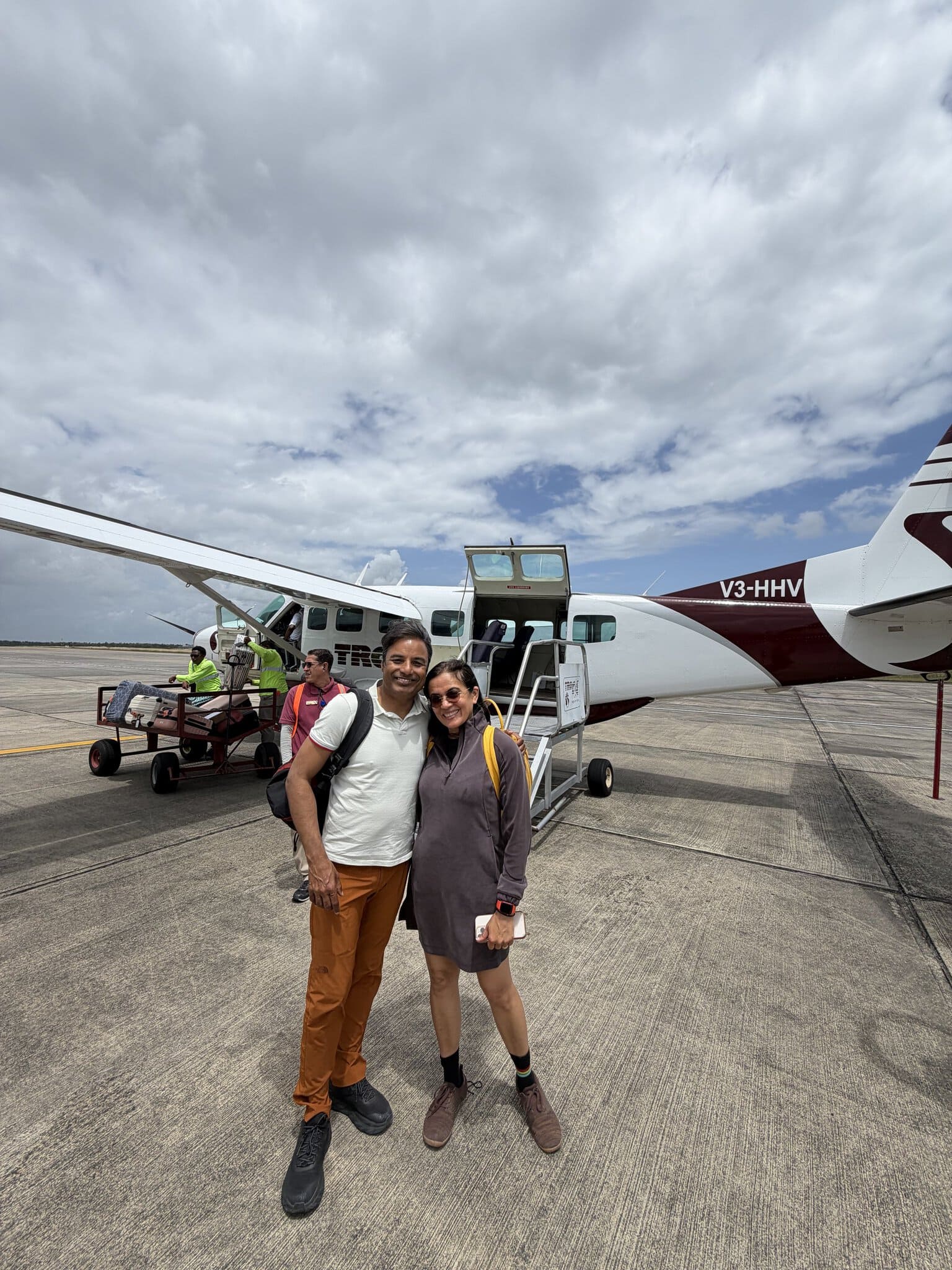 Nirmal and Jyoti disembarking the Tropic Air flight in Belize City