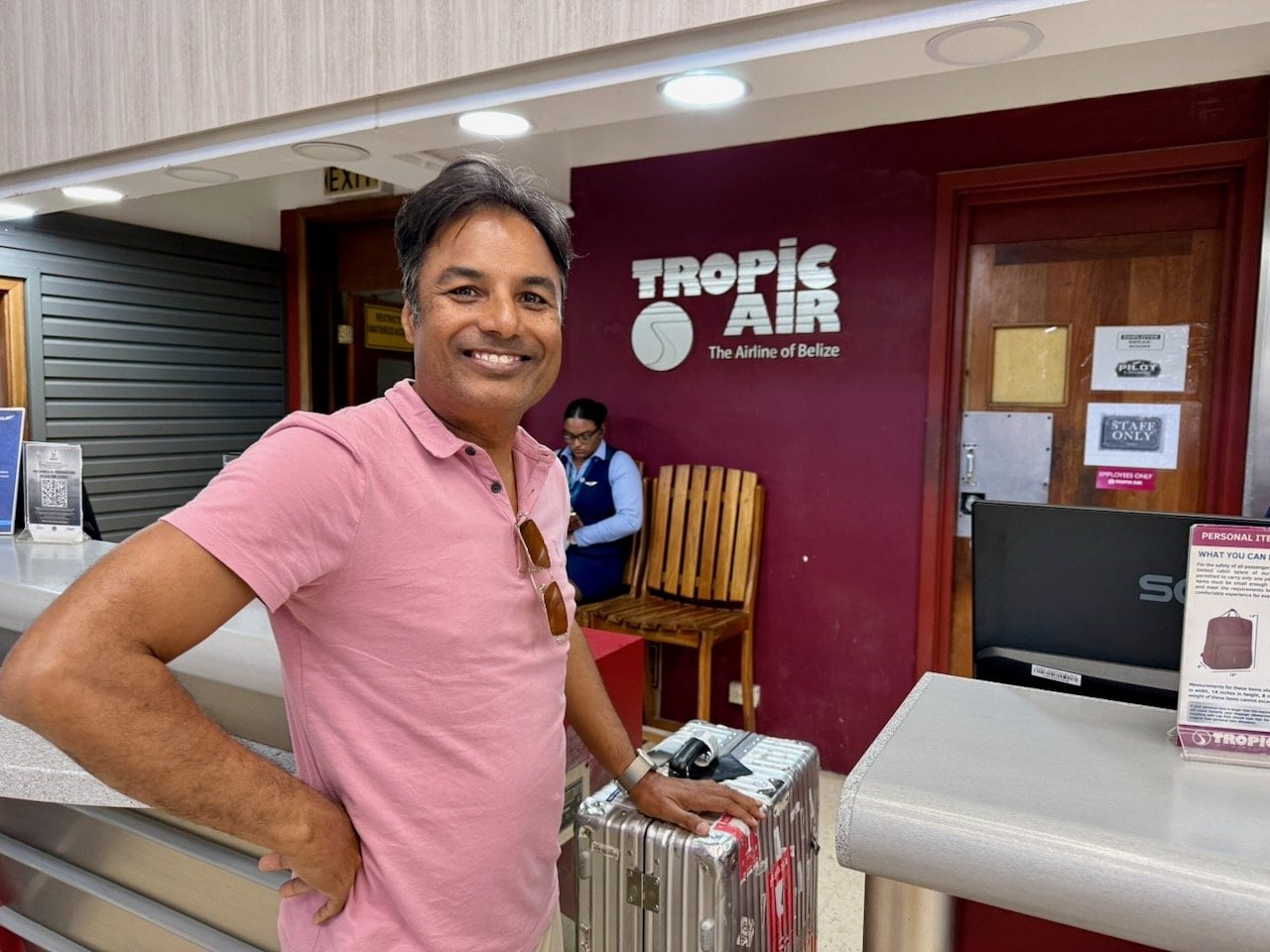 Nirmal checking in at the Tropic Air counter in Belize City before the 14-minute flight to San Pedro