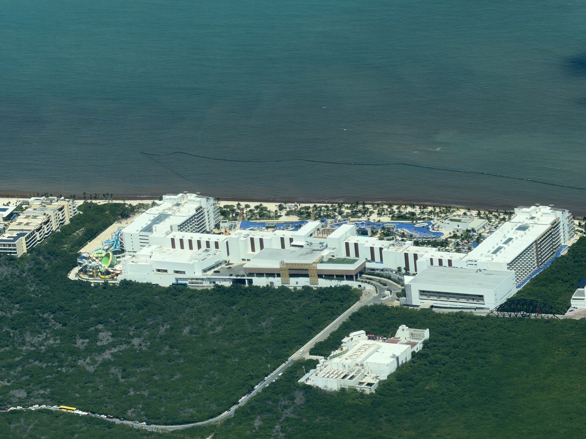 Aerial view of Royalton Splash Riviera Cancun resort with waterslides and pools along the Caribbean coast