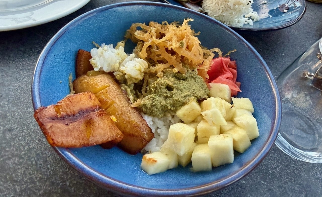 Vegan poke bowl with fried plantains, rice, pickled ginger, and banana at Vista Rooftop Lounge, Alaia Belize