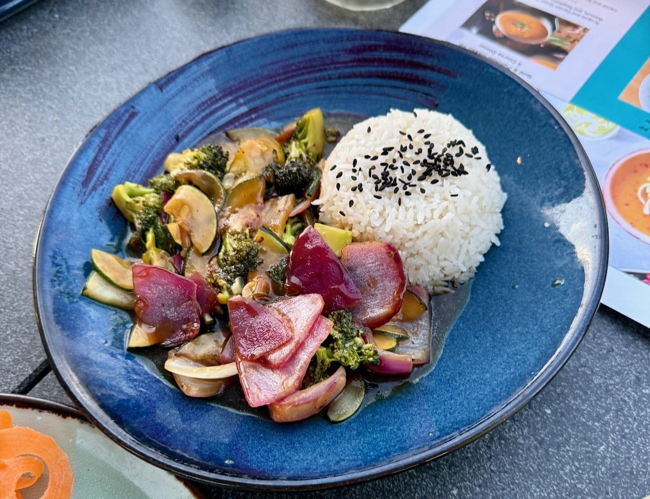 Vegan teriyaki vegetable stir-fry with sesame rice at Vista Rooftop Lounge, Alaia Belize