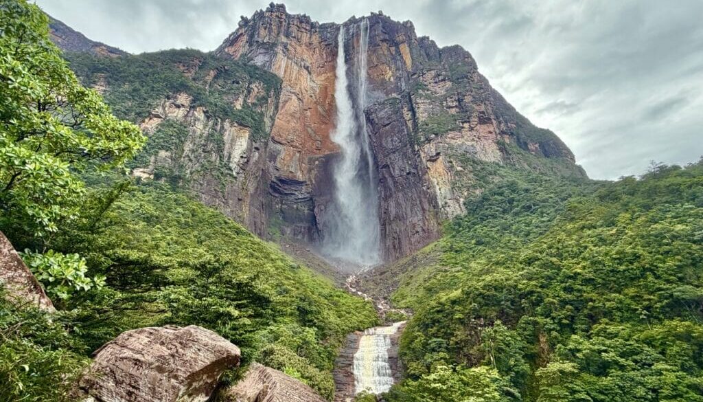 Angel Falls cascading down the Auyan Tepui cliff face, surrounded by lush rainforest in Venezuela
