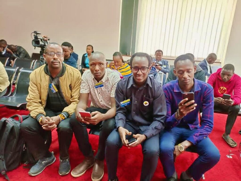 Four activists wait for a court hearing related to the Loliondo land case. Photo courtesy of Tubulu.